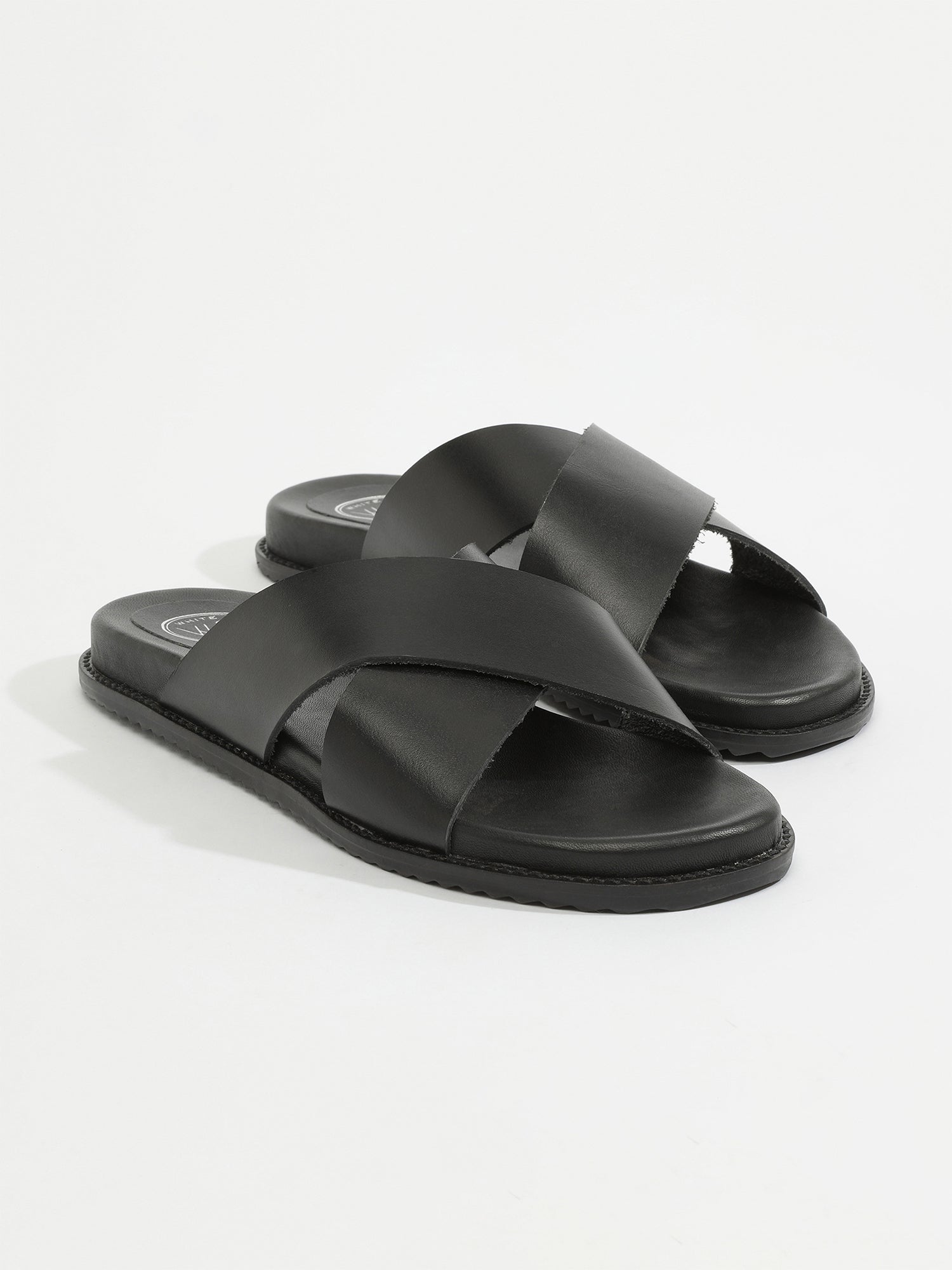 LOUTSIAN mules en cuir noir