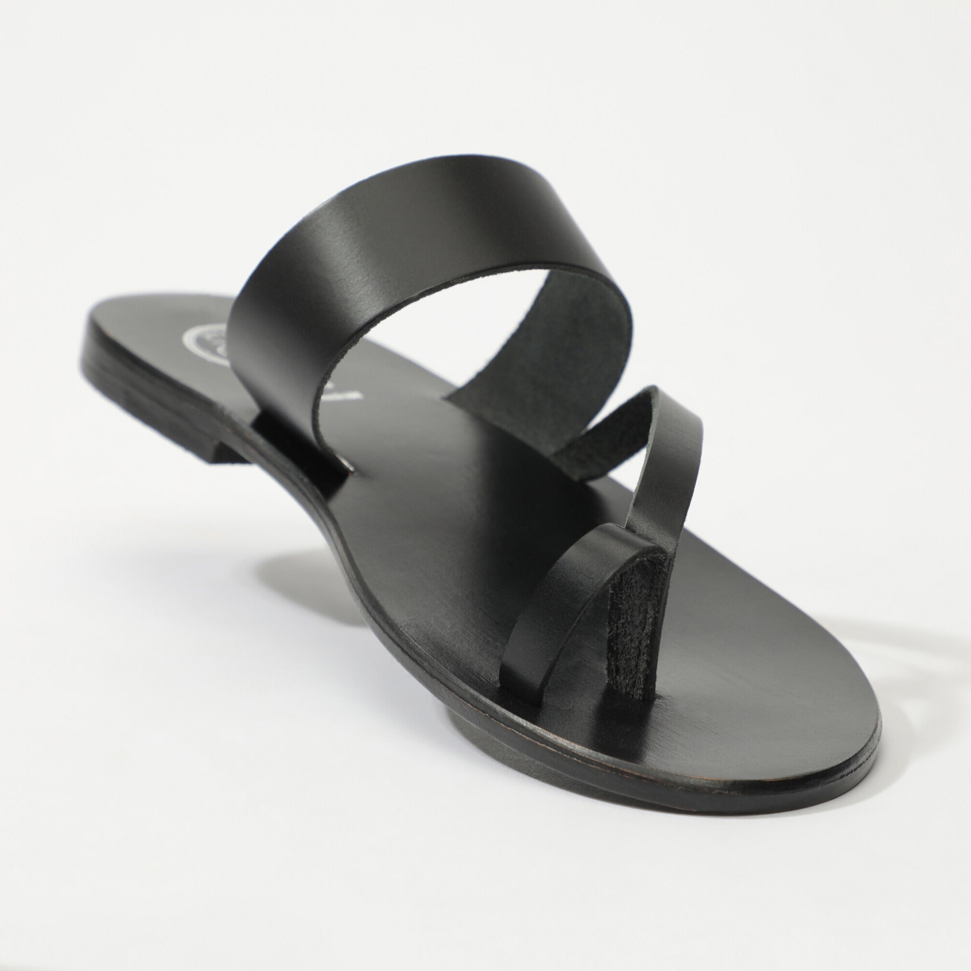 BREHAT mules entre doigt en cuir noir