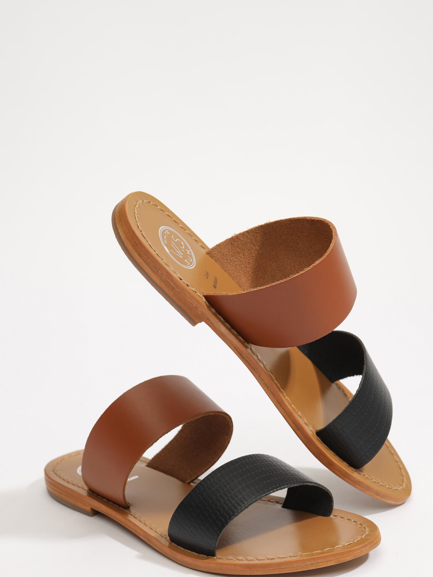 NATICA mules en cuir noir et camel