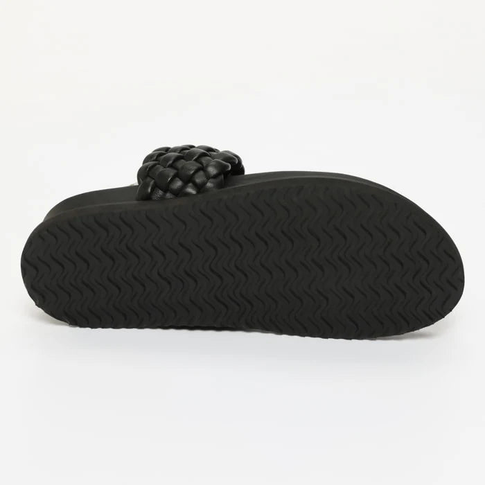 NAVAS mules en cuir noir